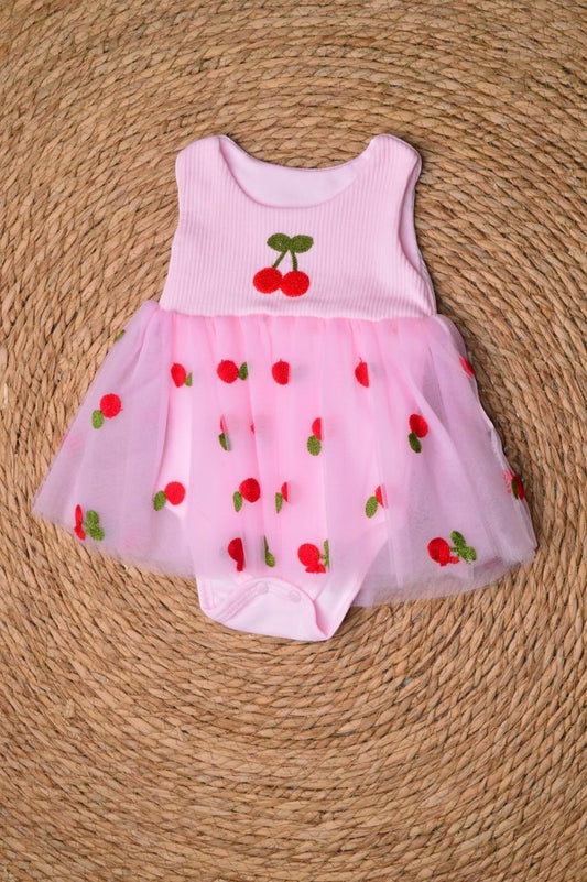 L'armoire De Yasmina pink ribbed romper with a tulle skirt adorned with embroidered cherries.