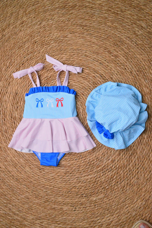 One piece swimsuit with a sun hat