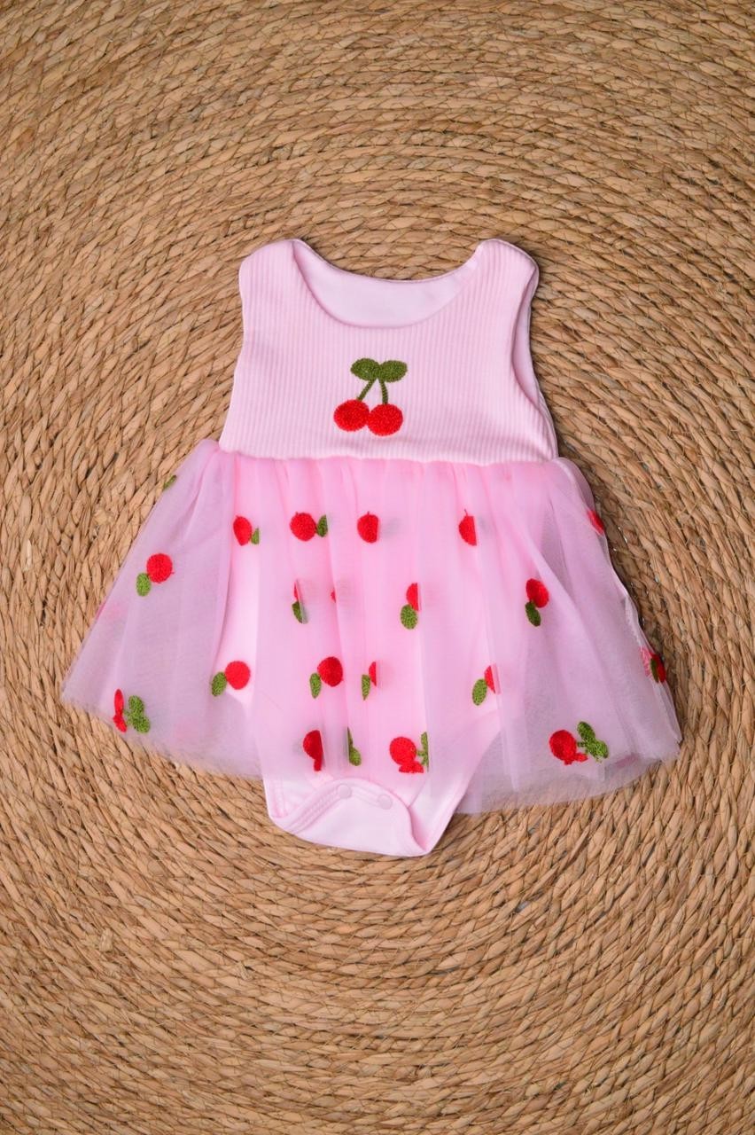 L'armoire De Yasmina pink ribbed romper with a sheer tulle overlay adorned with cherry embroidery.